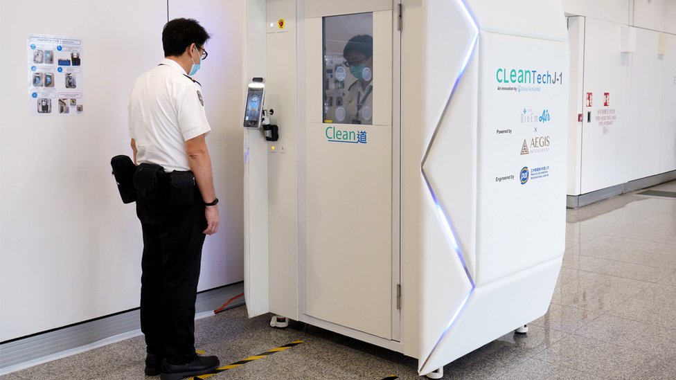 A staff member tours the CLeanTech full-body disinfection channel facilities at Hong Kong International Airport on April 24, 2020