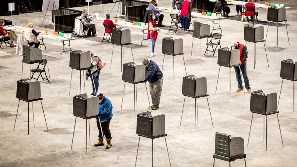 Voters cast their vote in the voting booths