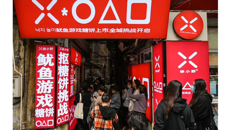 Queue outside a Squid Game snack bar in Shanghai