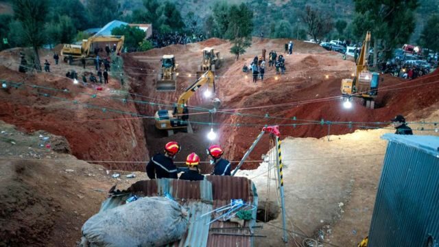 Firefighters work to rescue five-year-old Rayan, who became trapped in a deep well for days in Morocco's rural northern province of Chefchaouen