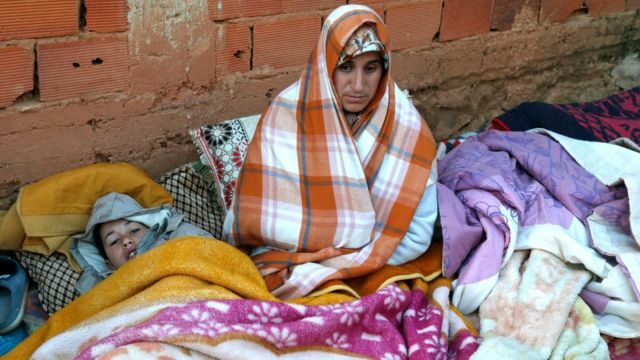 A Moroccan mother waits as rescue crews work to get five-year-old child Rayan out of a well